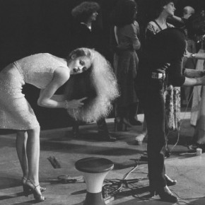 A Very Young Jerry Hall bending over and brushing her hair