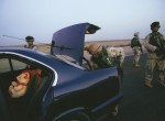 Thumbnail image: Stephanie Sinclair<br>Members of Charlie Company 1-505, 82nd Airborne, search a suspicious car during a mission to catch a Saddam loyalist in Fallujah, 2003-2006