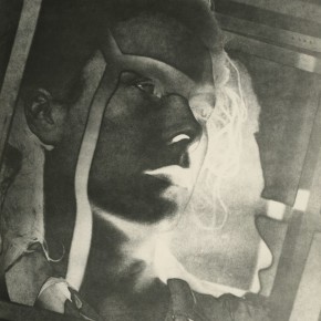 solarized woman's face in cage