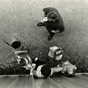 aerial view of man, woman and four children; one child is looking straight up
