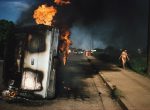 Thumbnail image: Car of a Somoza informer burning in Managua, 1978