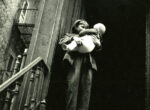 Thumbnail image: East 26th Street, New York (child holding infant on top of stairs)