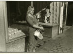 Thumbnail image: A Woman in Front of a Store, Syracuse, NY, 1985