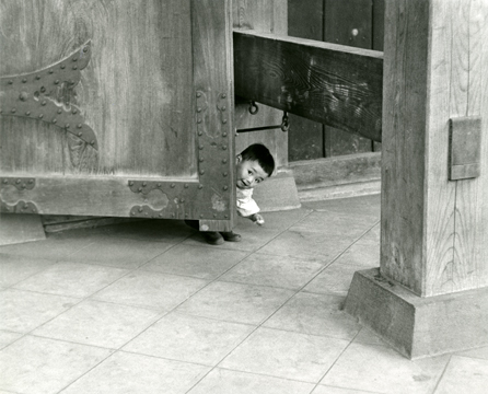Ken Heyman<br>Asakusa, Japan, Child of Caretaker Playing Peek-a-Boo, 1960s