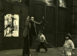 Thumbnail image: East 26rth Street (Boys with sticks on roller-blades with two young kids, New York City),