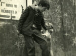 Thumbnail image: Boy and his dog on the sidewalk, New York City,