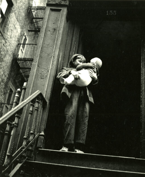 East 26th Street, New York (child holding infant on top of stairs)