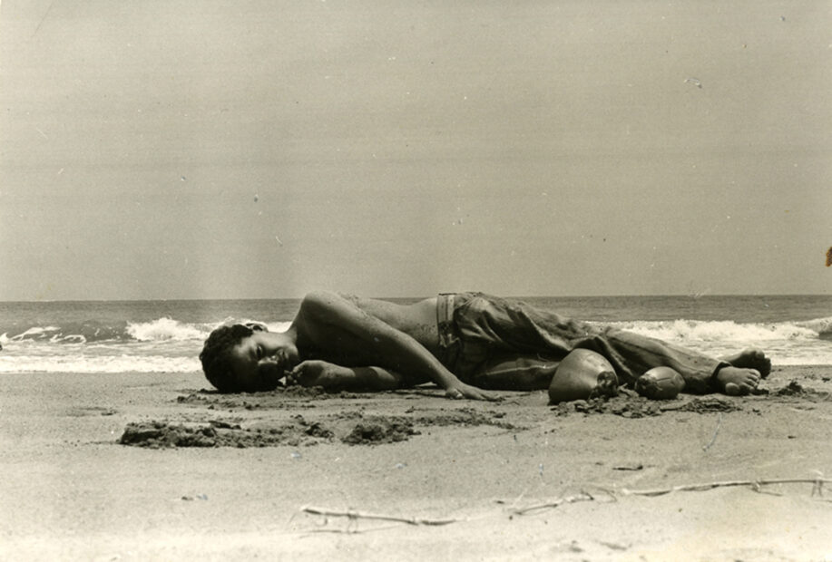 Untitled (boy laying on beach near Montauck)