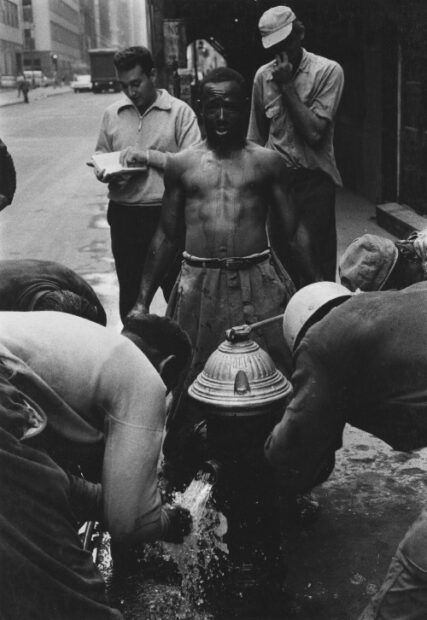 Nat Herz<br>Untitled, (men opening fire hydrant),