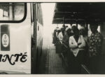 Thumbnail image: David Goldblatt<br>5:40 A.M.: After arrival at the Marabastedn terminal in Pretoria, many of the passenger from the Wolwekraal bus join other to line up for the local buses that will take them to work in the suburbs and industrial areas of the city,  Some will travel for another hour., 1983